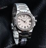 RRR Factory Patek Philippe Nautilus Cal.E 23-250SC Movement 32mm Light Pink Embossed Wave Pattern Face Women Watch